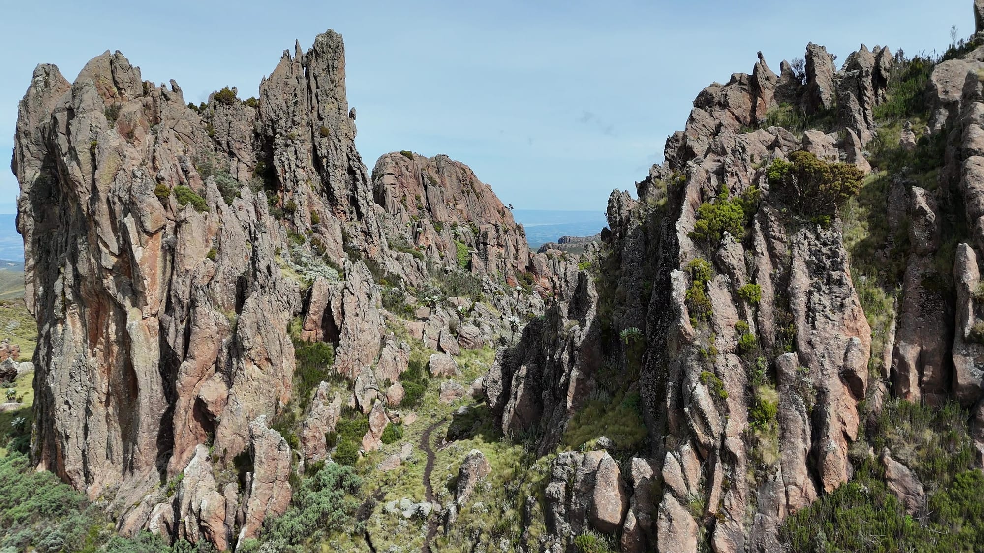 A narrow passage runs between tall, jagged rock walls at Dragon’s Teeth.